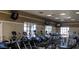 Well-equipped fitness center with modern exercise machines, TVs, and bright windows for a motivating workout environment at 105 S 224Th Ave, Buckeye, AZ 85326