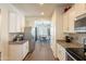 Modern kitchen with white cabinets and stainless steel appliances at 105 S 224Th Ave, Buckeye, AZ 85326