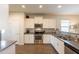 Modern kitchen with stainless steel appliances and granite countertops at 105 S 224Th Ave, Buckeye, AZ 85326