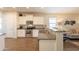 Open kitchen features granite counters and stainless steel appliances at 105 S 224Th Ave, Buckeye, AZ 85326