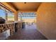 Covered patio with outdoor kitchen and stonework at 105 S 224Th Ave, Buckeye, AZ 85326