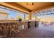 Outdoor kitchen with stone countertops and a pergola at 105 S 224Th Ave, Buckeye, AZ 85326