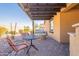 Covered patio with fire pit and seating area at 105 S 224Th Ave, Buckeye, AZ 85326