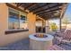 Covered patio with fire pit and seating area at 105 S 224Th Ave, Buckeye, AZ 85326