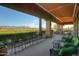 Spacious covered patio overlooks a golf course with mountain views at 105 S 224Th Ave, Buckeye, AZ 85326