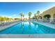 Community pool with lounge chairs and surrounding patio at 105 S 224Th Ave, Buckeye, AZ 85326