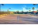 Well-maintained tennis court with mountain backdrop at 105 S 224Th Ave, Buckeye, AZ 85326