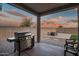 Covered patio with built-in grill and seating area at 10806 W King St, Avondale, AZ 85323