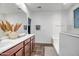 Elegant bathroom with double vanity, soaking tub, and walk-in shower at 10806 W King St, Avondale, AZ 85323