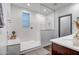 Modern bathroom with walk-in shower, built-in bench, and double vanity at 10806 W King St, Avondale, AZ 85323