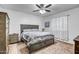 Spacious bedroom with a large bed, dresser, and ceiling fan at 10806 W King St, Avondale, AZ 85323