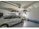 Spacious garage with overhead storage, car, and ample floor space at 10806 W King St, Avondale, AZ 85323