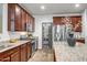 Spacious kitchen with stainless steel appliances and granite countertops at 10806 W King St, Avondale, AZ 85323