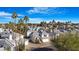 Aerial view of a neighborhood with well-maintained homes and mature palm trees against a blue sky at 1179 N Granada Dr, Chandler, AZ 85226