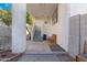 Covered backyard patio featuring stairs to the house, benches and desert landscaping at 1179 N Granada Dr, Chandler, AZ 85226