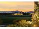 Luxury home at dusk, golf course views, mountain backdrop at 11890 N 118Th St, Scottsdale, AZ 85259