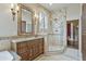 Elegant bathroom with walk-in shower, granite vanity, and mosaic tile at 11890 N 118Th St, Scottsdale, AZ 85259