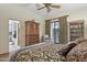 Bedroom with king-size bed, built-ins, and access to bathroom at 11890 N 118Th St, Scottsdale, AZ 85259