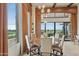 Bright dining room with large windows and golf course views at 11890 N 118Th St, Scottsdale, AZ 85259