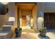 Elegant entryway with a herringbone tile floor and wood door at 11890 N 118Th St, Scottsdale, AZ 85259