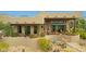 Back exterior showcasing a covered patio and fire pit at 11890 N 118Th St, Scottsdale, AZ 85259