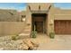 Stunning stucco home with wood accents and a charming entrance at 11890 N 118Th St, Scottsdale, AZ 85259