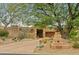 Front yard with mature trees and desert landscaping at 11890 N 118Th St, Scottsdale, AZ 85259