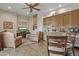 Small kitchenette with wood cabinets, granite counters, and a mini-fridge at 11890 N 118Th St, Scottsdale, AZ 85259