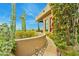 Landscaped pathway with cacti and bougainvillea leads to a home with scenic views at 11890 N 118Th St, Scottsdale, AZ 85259