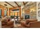 Spacious living room with stone fireplace and large windows at 11890 N 118Th St, Scottsdale, AZ 85259