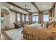 Main bedroom with king-size bed and wood ceiling beams at 11890 N 118Th St, Scottsdale, AZ 85259