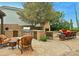 Outdoor kitchen with built-in grill and fireplace at 11890 N 118Th St, Scottsdale, AZ 85259