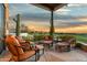 Patio with seating and sunset views over the golf course at 11890 N 118Th St, Scottsdale, AZ 85259