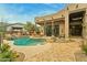 Inviting pool area with flagstone patio and desert landscaping at 11890 N 118Th St, Scottsdale, AZ 85259