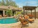 Relaxing pool area with patio furniture and pergola at 11890 N 118Th St, Scottsdale, AZ 85259