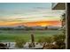 Scenic sunset view over a golf course and mountains at 11890 N 118Th St, Scottsdale, AZ 85259