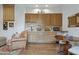 Wet bar with wood cabinets, granite countertop, and mini-fridge at 11890 N 118Th St, Scottsdale, AZ 85259