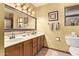 Double vanity bathroom with a large mirror and plenty of counter space at 12450 W Fieldstone Dr, Sun City West, AZ 85375