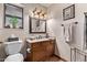 Bathroom with granite countertop and wood cabinets at 12450 W Fieldstone Dr, Sun City West, AZ 85375