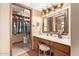 Bathroom vanity with ample storage and mirror at 12450 W Fieldstone Dr, Sun City West, AZ 85375