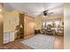 Bedroom with a murphy bed, desk, and ceiling fan at 12450 W Fieldstone Dr, Sun City West, AZ 85375