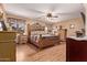 Comfortable main bedroom with wood furniture and a ceiling fan at 12450 W Fieldstone Dr, Sun City West, AZ 85375