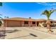 Front view of a single-story home with a landscaped yard at 12450 W Fieldstone Dr, Sun City West, AZ 85375