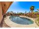 Relaxing kidney shaped pool with surrounding patio at 12450 W Fieldstone Dr, Sun City West, AZ 85375