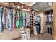 Large walk-in closet with custom shelving and rods at 12450 W Fieldstone Dr, Sun City West, AZ 85375