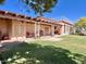 Large backyard with covered patio and grassy area at 13602 S Garnet Rd, Buckeye, AZ 85326