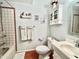 Clean bathroom with tiled walls, a bathtub, and a vanity at 13602 S Garnet Rd, Buckeye, AZ 85326