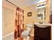 Clean bathroom with shower/tub combo and dark vanity at 13602 S Garnet Rd, Buckeye, AZ 85326