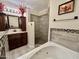 Bathroom features a large soaking tub, walk-in shower, and double vanity at 13602 S Garnet Rd, Buckeye, AZ 85326