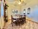 Formal dining room with six chairs and tiled floors at 13602 S Garnet Rd, Buckeye, AZ 85326